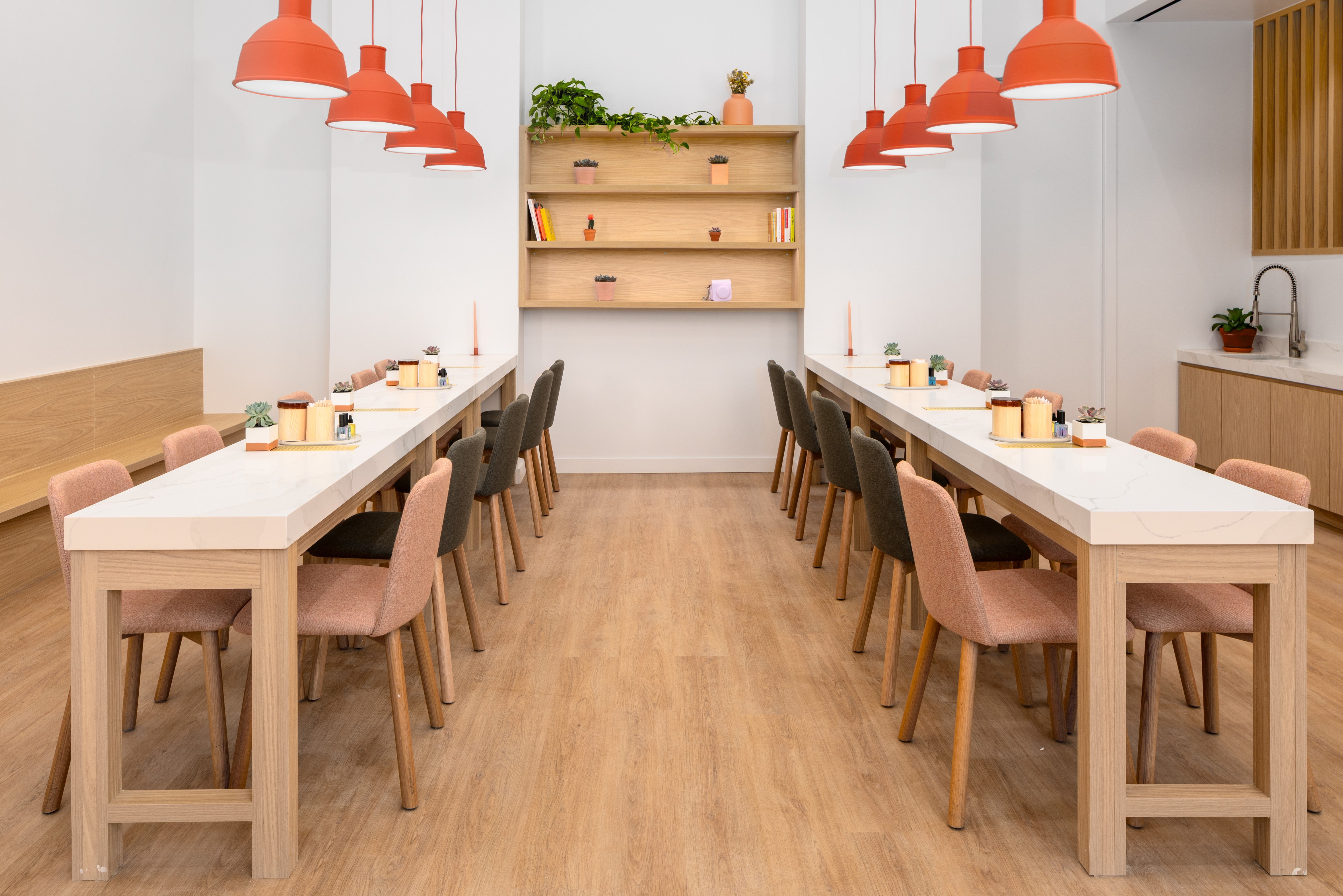 Dearsundays studio with long tables and chairs and red pendant lights